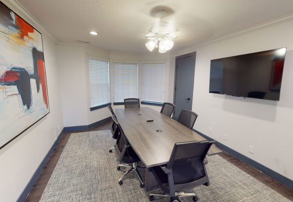 A six person conference room with TV and HDMi hookup