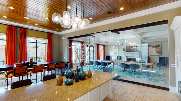 A long kitchen island and glass entryway