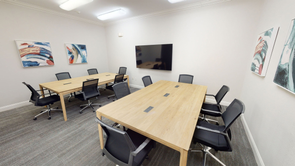 A 12-person conference room with TV and HDMi