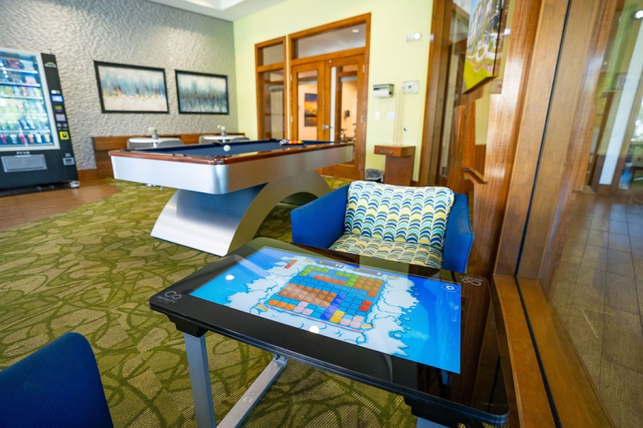 Take a break, challenge a friend, and unwind at the Game Table or pool table.