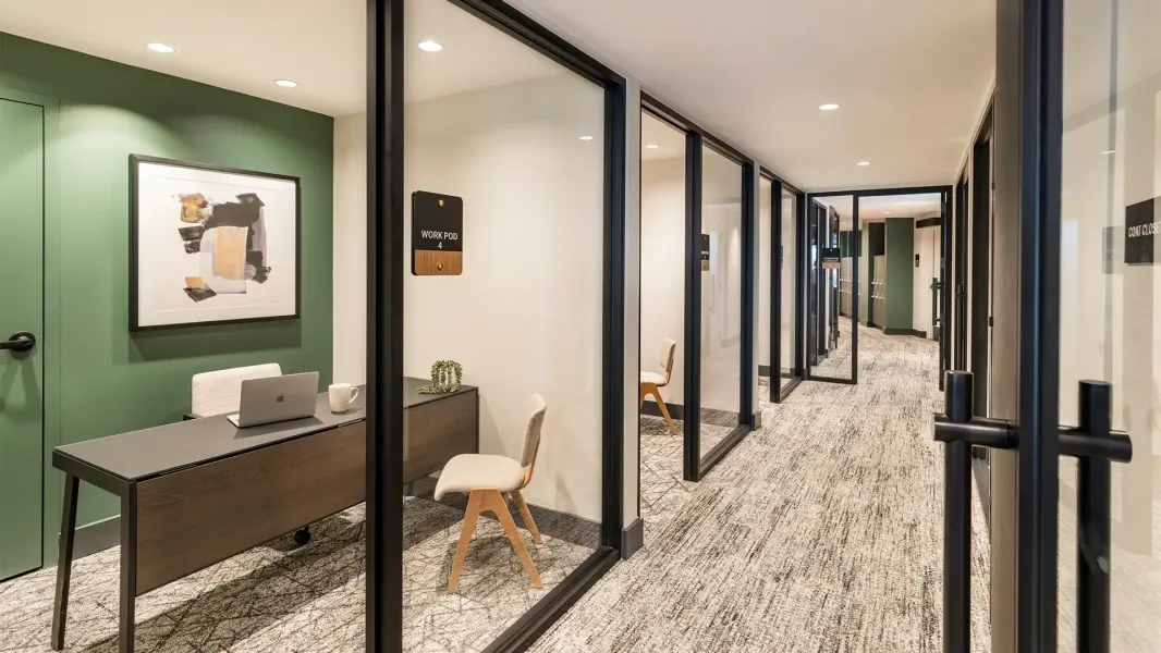 A private office furnished with a table and chair.