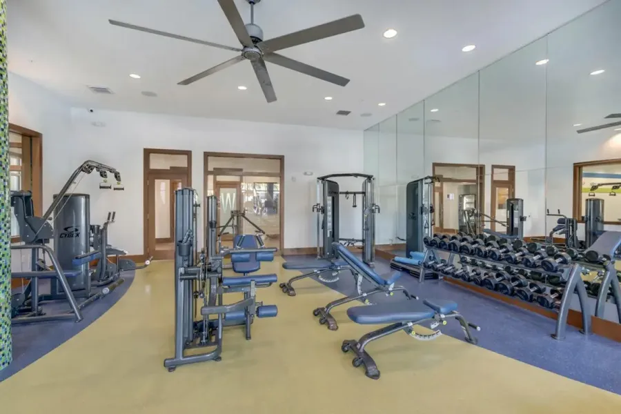 Fitness center in a Westchase coworking space featuring modern equipment, available to members.